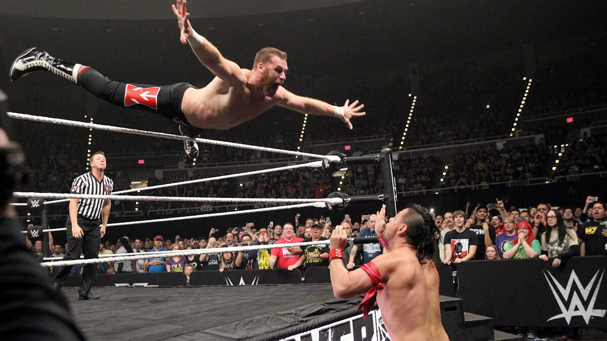 Zayn displayed his usual flair for air, sailing over the top rope to attack Nakamura outside the ring.