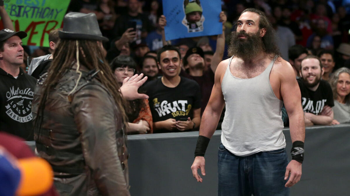 On his way to the ring, he runs into his former follower, Luke Harper.