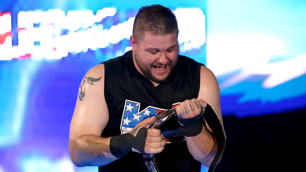 Now a three-time United States Champion, Owens celebrates with his prize after rolling Styles up for the pinfall.