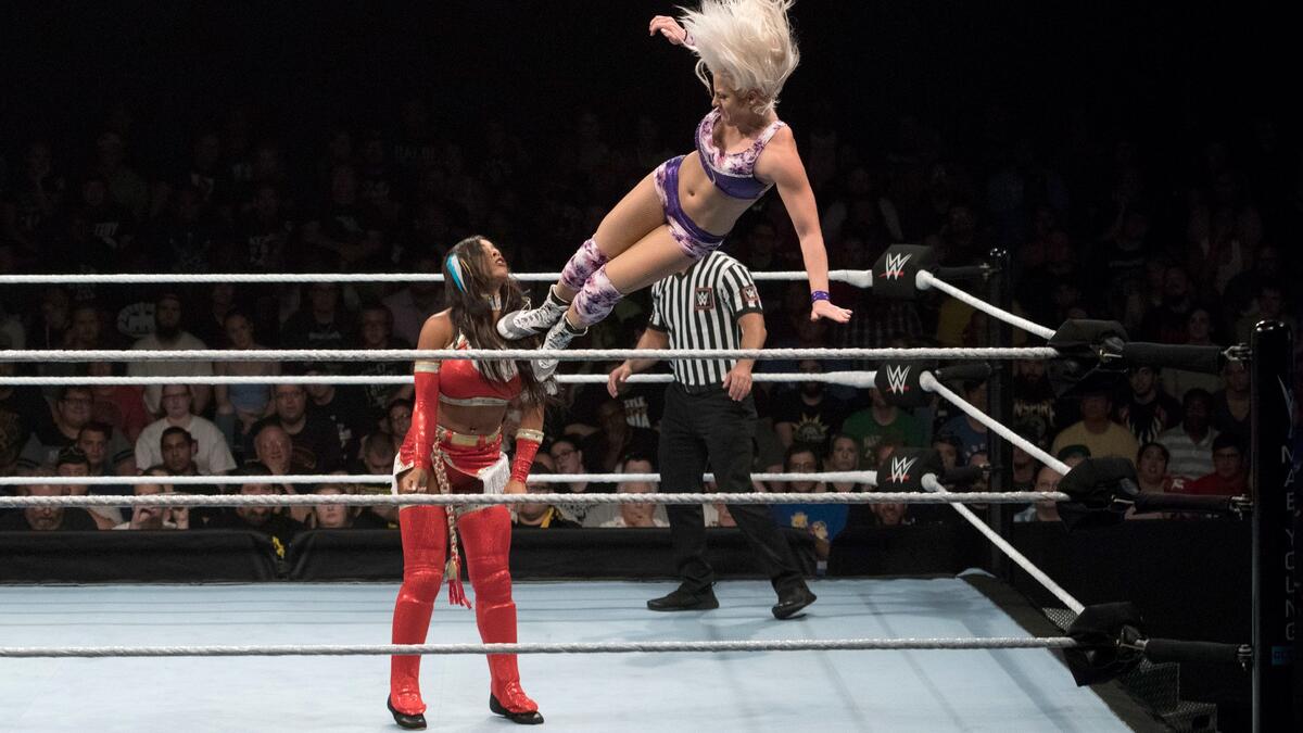 The tiny, yet fierce LeRae flies off the top rope with a gorgeous missile dropkick. The tiny, yet fierce LeRae flies off the top rope with a gorgeous missile dropkick.