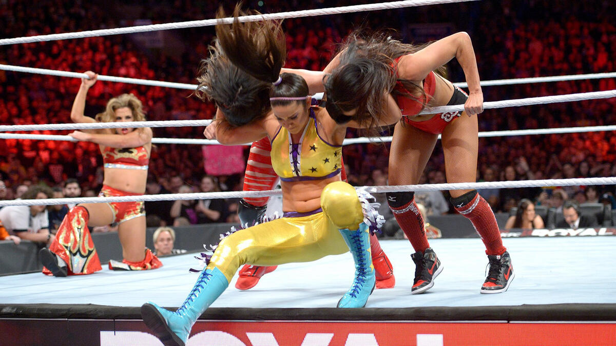 Bayley enters the fray and takes out The Bellas.