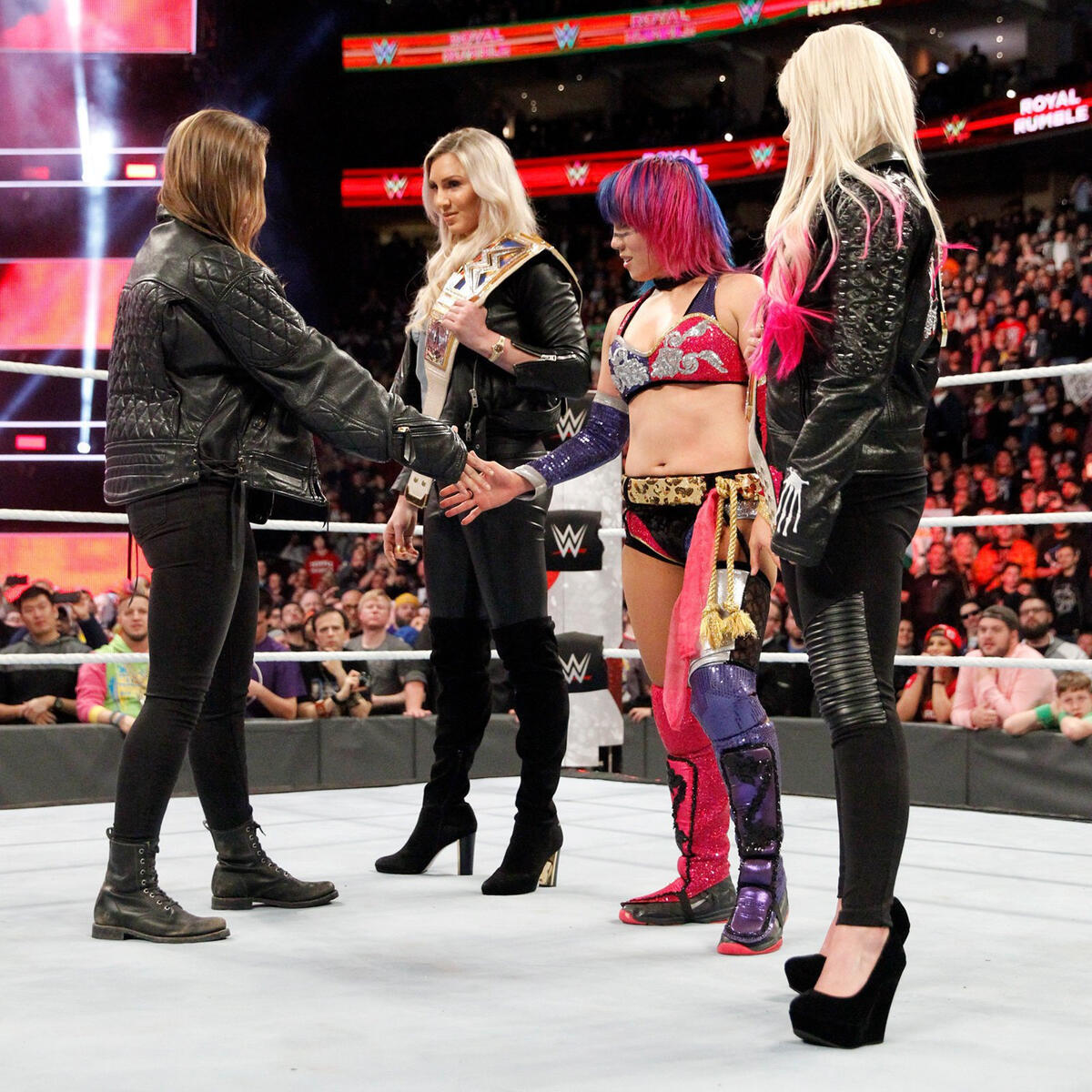 Asuka is not impressed by Rousey and refuses to shake her hand.