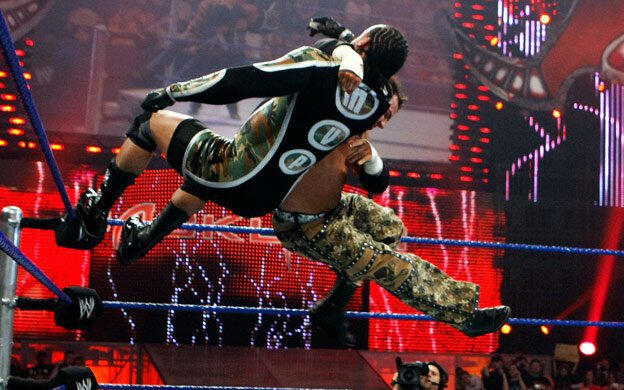 Hardy delivers a Side Effect from the second turnbuckle.