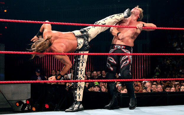 Michaels delivers Sweet Chin Music to Jericho on the apron.