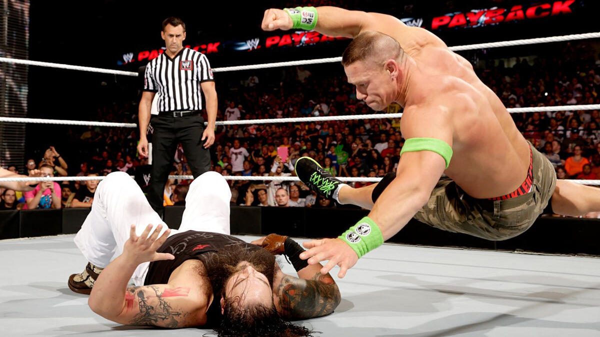 Cena looks to end this encounter early, preparing to hit Wyatt with the Attitude Adjustment.