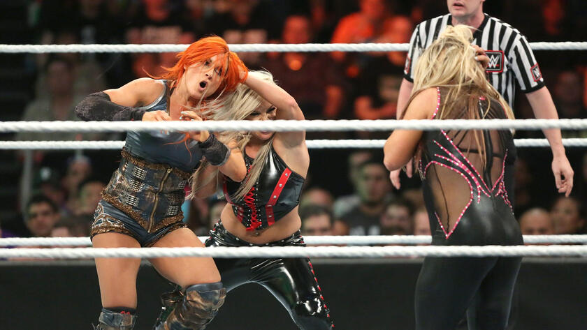 She then throws Becky into The Queen of Harts, allowing Charlotte to defeat Natalya with Natural Selection.