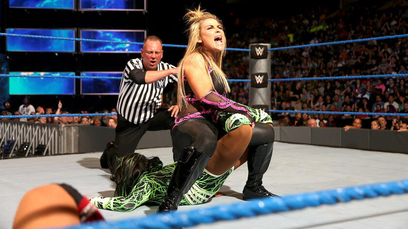 Naomi taps out to the sharpshooter. 