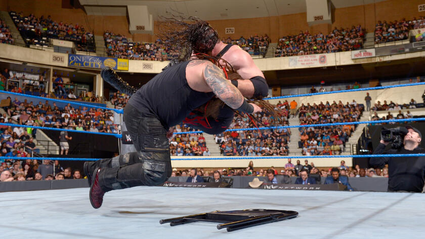 Kane reverses Sister Abigail into a DDT