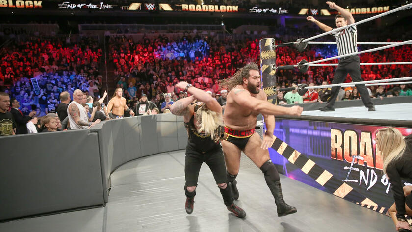 Outside the ring, Rusev clobbers Enzo.