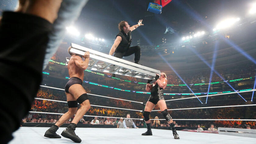 Ambrose makes an innovative attempt to grab the blue briefcase.
