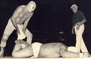 Mexican legend El Santo works over an opponent.