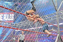John Cena hits The Miz with an Attitude Adjustment.