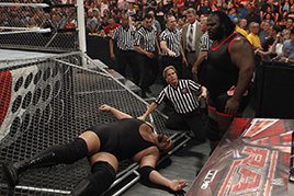 Mark Henry sends Big Show through the steel cage wall