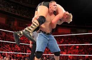John Cena delivers an Attitude Adjustment to Jack Swagger.