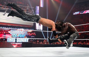 R-Truth drives John Morrison's head into the mat.