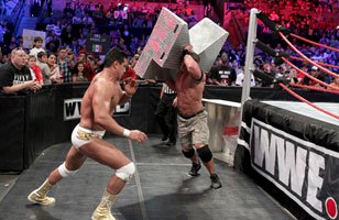 Cena attacks Alberto Del rio with the ring steps at Vengeance.