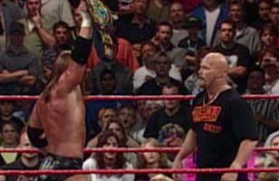Stone Cold takes over for unconscious official, awards WWE Title to Triple H at Unforgiven 1999.