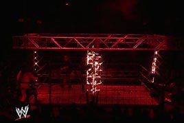 Kane sets a steel cage ablaze on Monday Night Raw