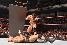 Wade Barrett tosses a table at Randy Orton at WWE TLC 2011