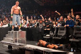 John Cena sends Randy Orton crashing through a table
