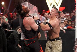 John Cena goes after Kane with the steel ring steps