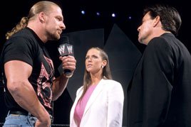 Stephanie McMahon and Eric Bischoff try to convince Triple H to join their brand