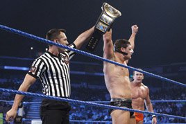 The referee raises the arm of Cody Rhodes, the new Intercontinental Champion.