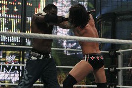 R-Truth and CM Punk grapple in the 2010 Elimination Chamber Match.