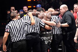 R-Truth is helped to the locker room by WWE officials on Raw SuperShow.