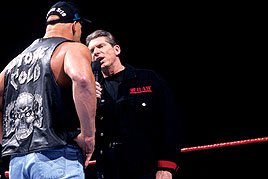 Facing "Stone Cold" Steve Austin, Mr. McMahon sports an edgy Raw jacket.