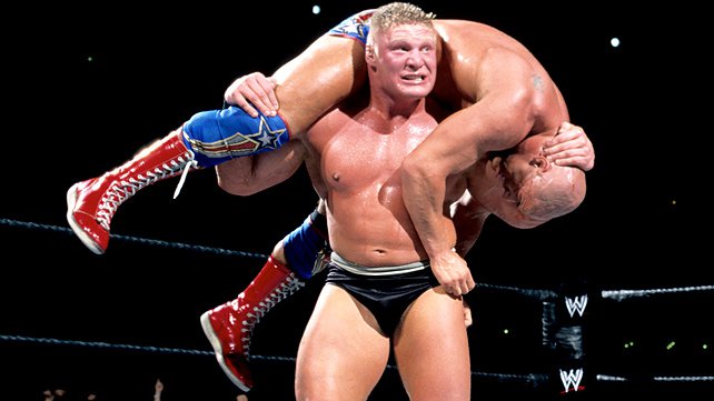 Brock Lesnar gives an F-5 to Kurt Angle