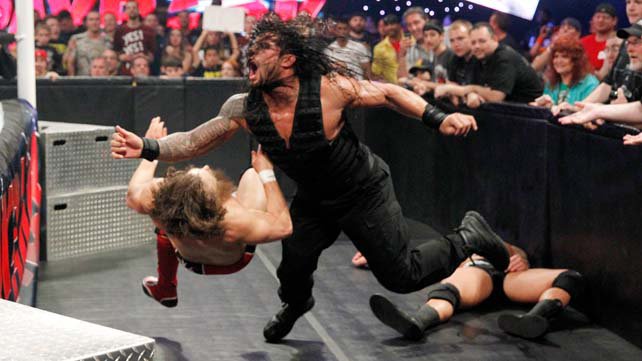 Roman Reigns tears through Daniel Bryan during a WWE Tag Team Title contest at WWE Payback.