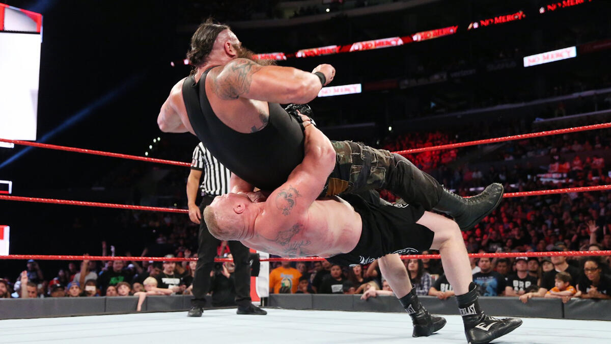 Lesnar suplexing Strowman (Picture: WWE)