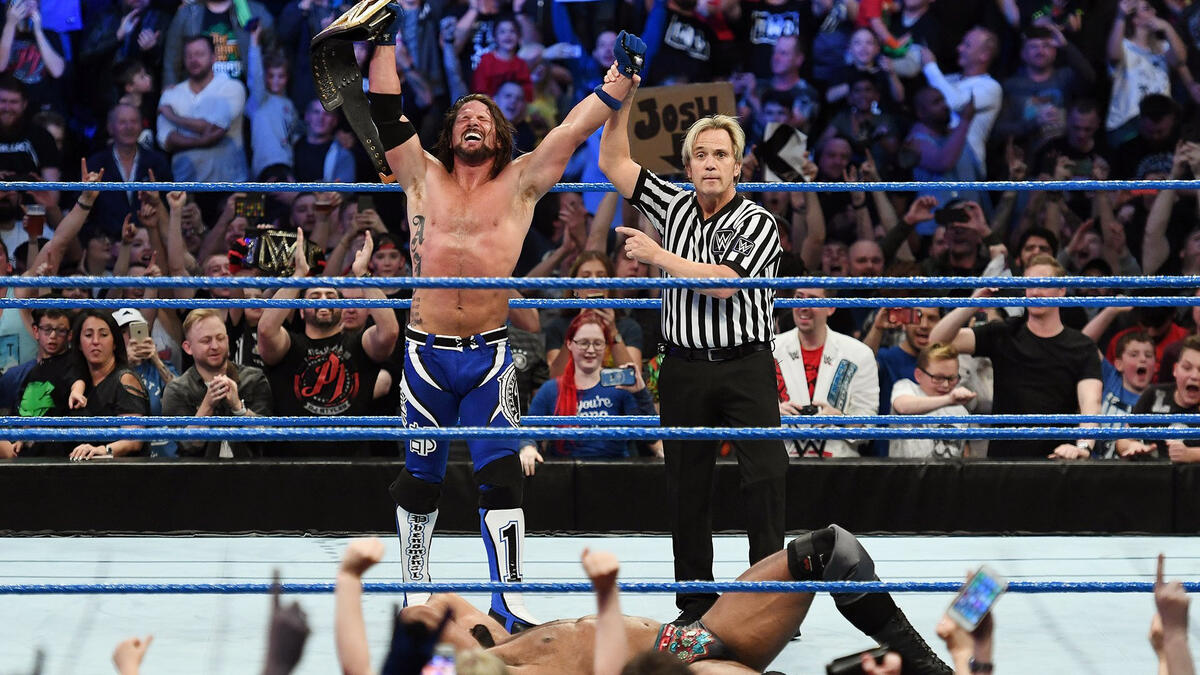 Styles celebrates as the new WWE Champion!
