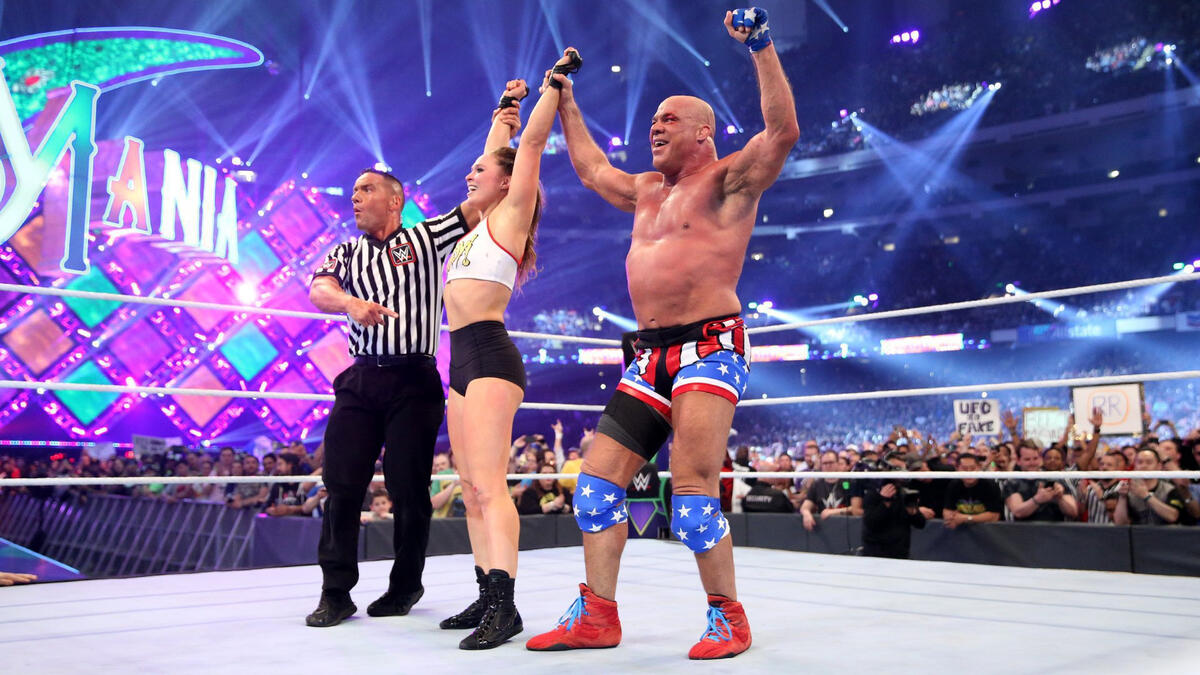 Kurt Angle & Ronda Rousey vanquish Stephanie McMahon & Triple H at WrestleMania after The Baddest Woman on the Planet forces Stephanie to tap out!
