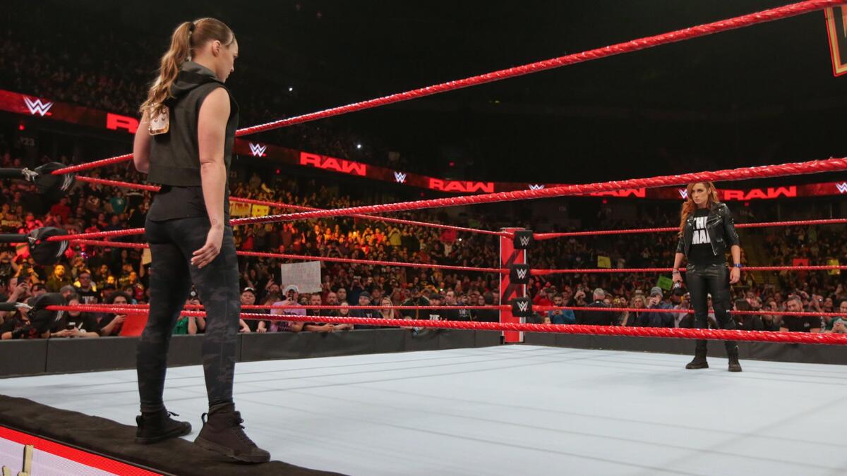 Suddenly, Raw Womenâs Champion Ronda Rousey hits the scene!