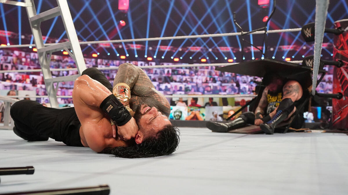 Roman Reigns spears Kevin Owens through a table to retain his Championship at WWE: TLC 2020
