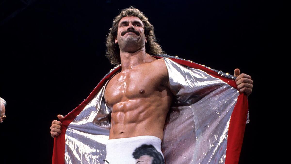 Rick Rude opening his robe in the ring
