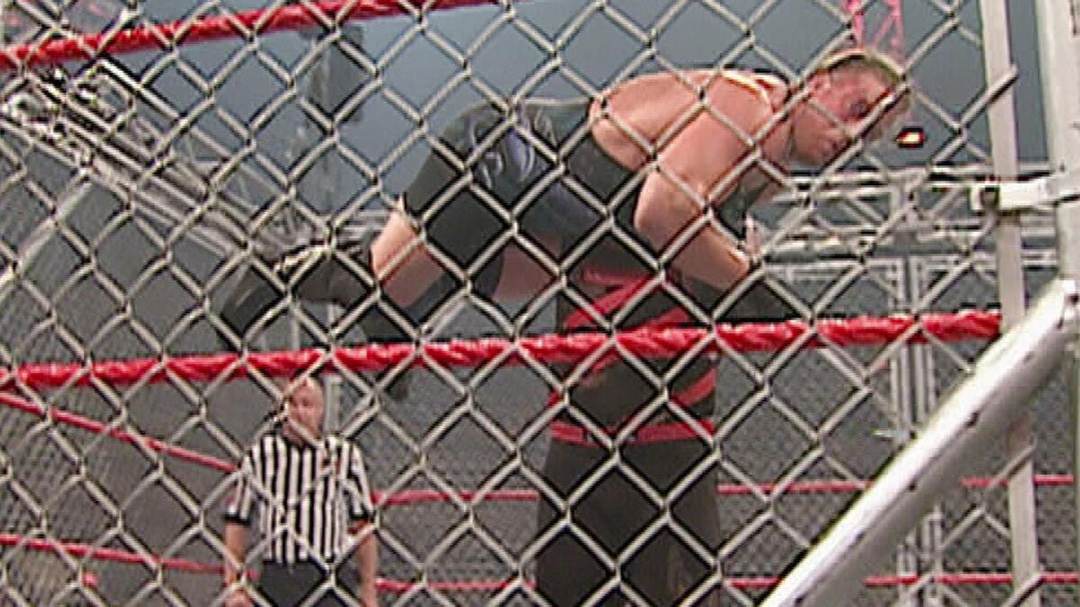 Kane With Rvd Kane throws RVD through the steel cage: Raw, Sept. 8, 2003 | WWE