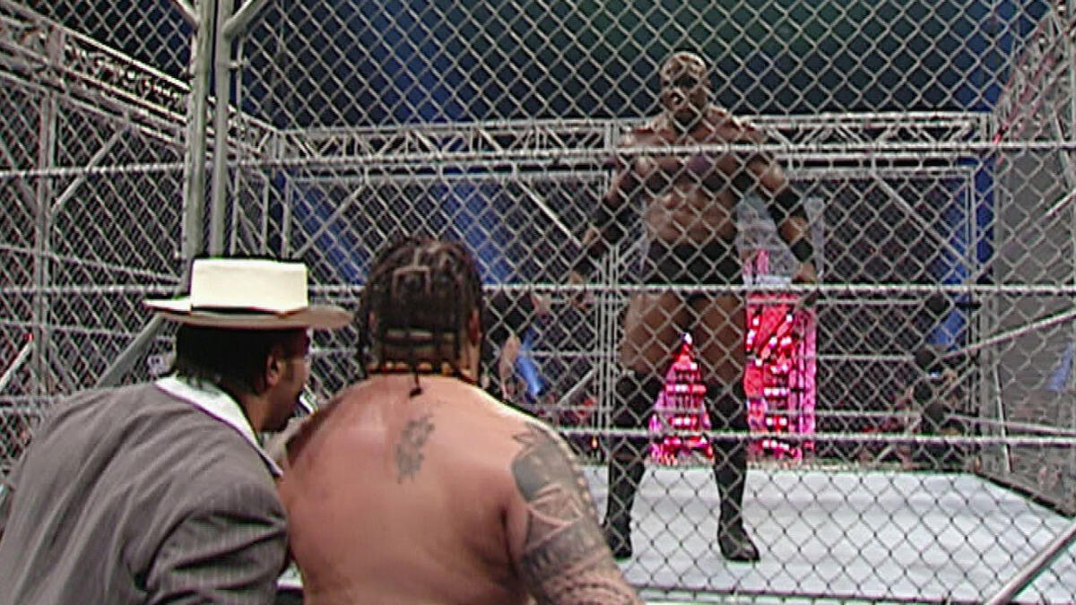 Bobby Lashley dives through the steel cage onto Umaga: ECW, Feb. 27, 2007 |  WWE