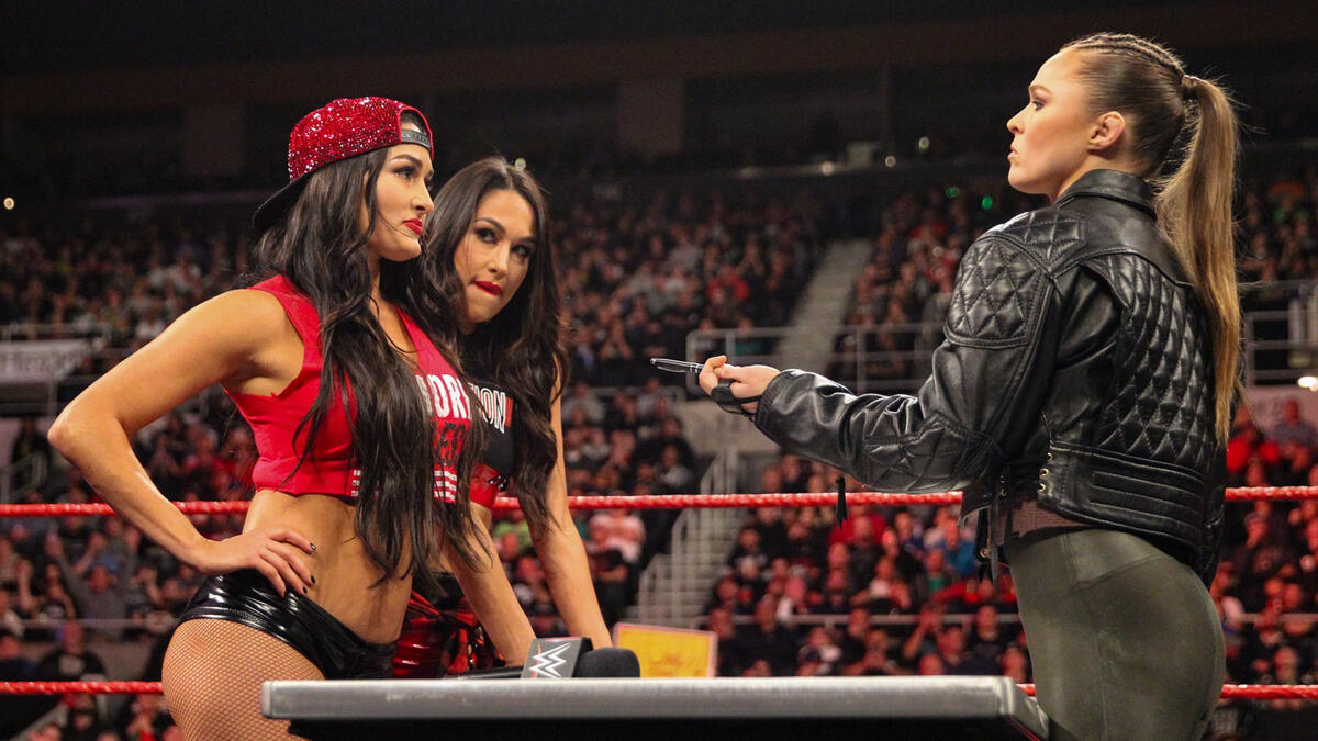Raw Women S Champion Ronda Rousey And Nikki Bella Signed Their Wwe