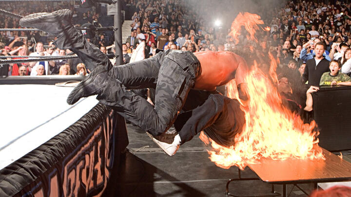 Edge spears Mick Foley through a flaming table: WrestleMania 22 | WWE