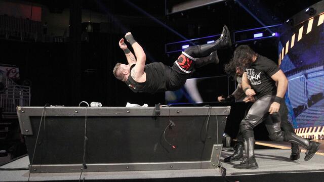 Seth Rollins and Roman Reigns powerbomb Kevin Owens