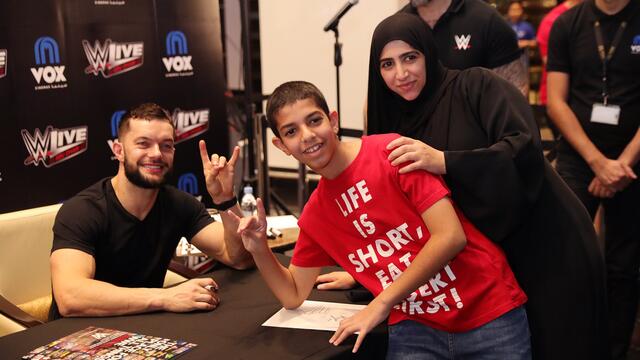 Finn Bálor and Jason Jordan signing in Abu Dhabi - December 2017