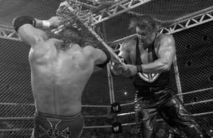 Kevin Nash and Triple H in their Hell in a Cell Match.