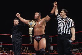 The Rock wins the WWE Championship at Survivor Series 1998.