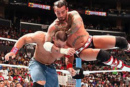 CM Punk gives a bulldog to John Cena